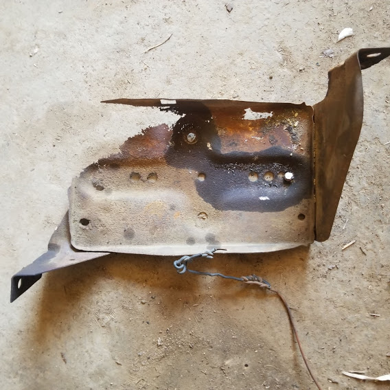The old battery tray, corroded and ready for scrap